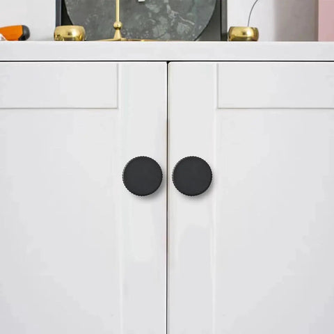 Matte Black Cabinet Knob Set Five Pack For Kitchen Drawers And Furniture Doors installed on white cabinet