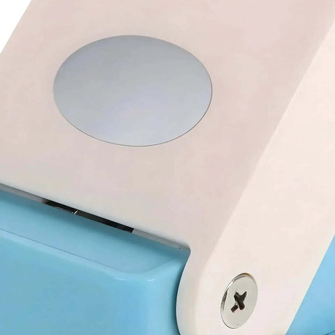 Close-up of Portable Oval Tab Punch For Scrapbooking And Card Making, showing steel cutting edge and easy grip handle.
