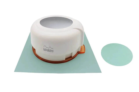 2-Inch Circle Magnetic Punch for Paper Crafting and Scrapbooking on teal paper, cutout circle shown.