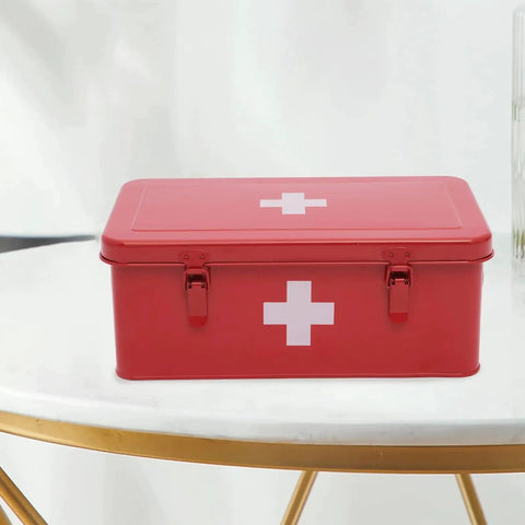 Red Rock Solid Metal First Aid Box With Safety Lock for Home Emergency Kit, durable steel, moisture and dust resistant, on a table.