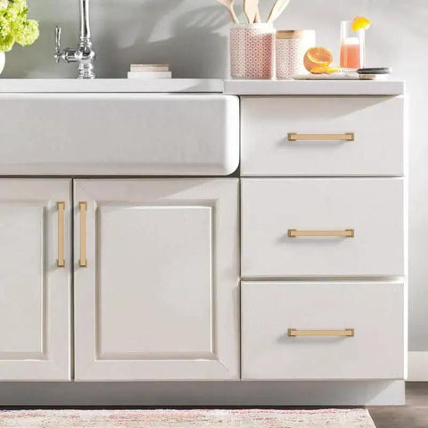 10 Pack 5 Inch Cabinet Handles In Champagne Bronze For Kitchen And Dresser Drawers installed on white cabinet doors and drawers