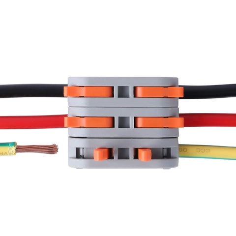 XHF lever connector block, gray housing with orange clamps, black and red conductors plus yellow-green ground wire attached