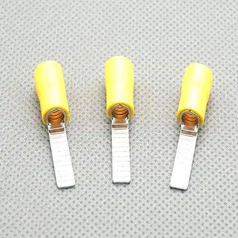 Three Yellow 5.5-18 Electric Crimp Ferrule Blade Terminals for 4-6 MM2 Wires on textured surface