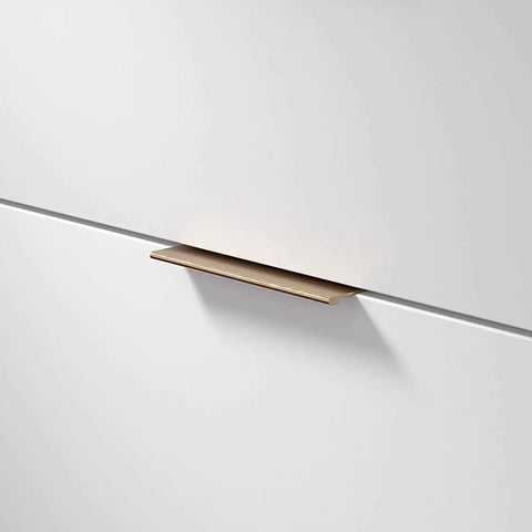 Lincoln Collection 5 1/16 Inch Center To Center Brushed Champagne Bronze Modern Cabinet And Drawer Edge Pull Handle installed on drawer
