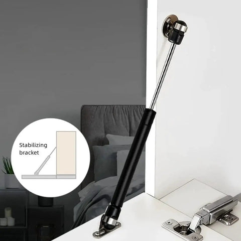 Image of 6 Inch Gas Struts For Cabinets 20N 4.4lb, showing a black cabinet shock lift with mounting brackets and screws installed on a cabinet door.