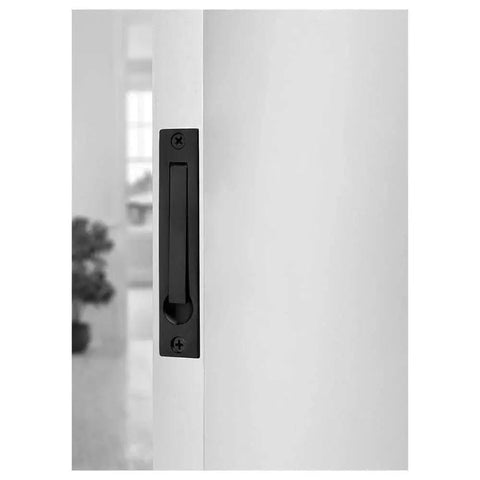 Edge Pull Latch Set For Barn Doors And Closets, Solid Forged Brass Handles In Matte Black, installed on white door, side view