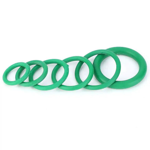 Green O-rings from 270 Pcs O Ring Kit With 18 Size Assortment High Temperature Buna N Rubber Gaskets For Automotive, Plumbing, Pneumatic, Pressure Washer And Gas Sealing, Leak Proof Seals For Faucets, Machinery, And More displayed in a line.