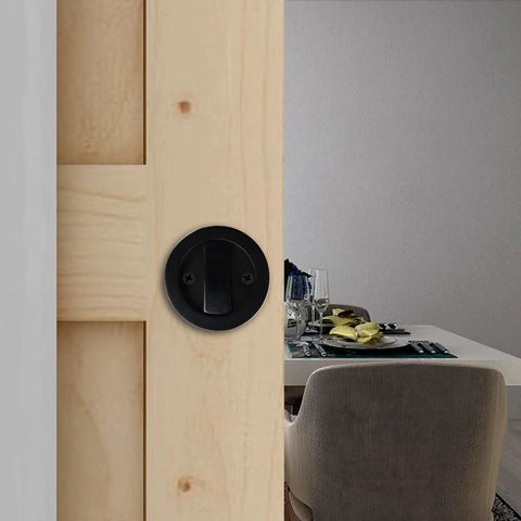 Invisible Barn Wood Sliding Door Lock Hardware With Cup Handle And Keys, Black Finish, 2.95 Inch Diameter, Zinc Alloy Pocket Door Lock for Barn Doors installed on wooden barn door.