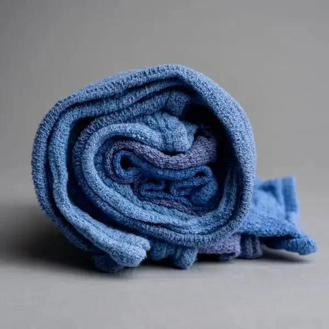 Rolled blue towel from Pro Grade Reclaimed Huck Towels Box With 25 Lb Contents, About 225 Recycled Rags, 16x24 Inches, 100 Percent Cotton
