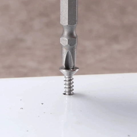Close-up of Number Ten By One And A Half Inch Sheet Metal Screw being installed in surface, showing stainless steel finish.
