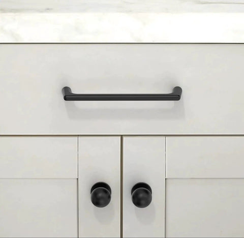 Matte Black Round Kitchen Cabinet Knobs and Drawer Knobs Set, 10 Pack, shown installed on modern white cabinetry