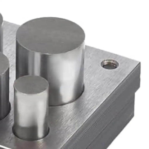 Disc Cutter Set For Jewelry Making 5 Piece Round Punch Tool Kit with various round sizes on metallic base.