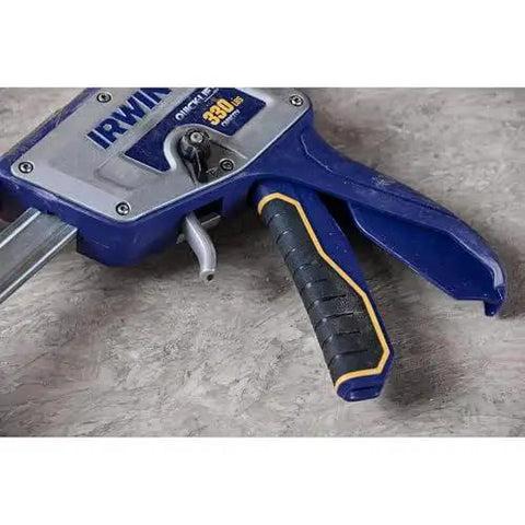 Close-up of Quick Lift Construction Jack with 10 Inch Lift and 330 Lb Capacity, showing handle and trigger mechanism.