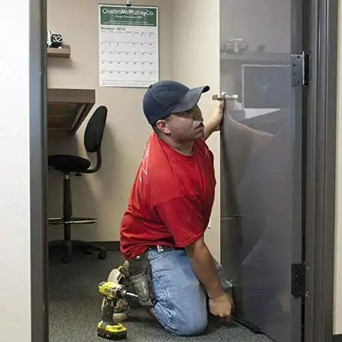 Air Shim XL inflatable pry bar and leveling tool in use to align a door; gray inflatable wedge.