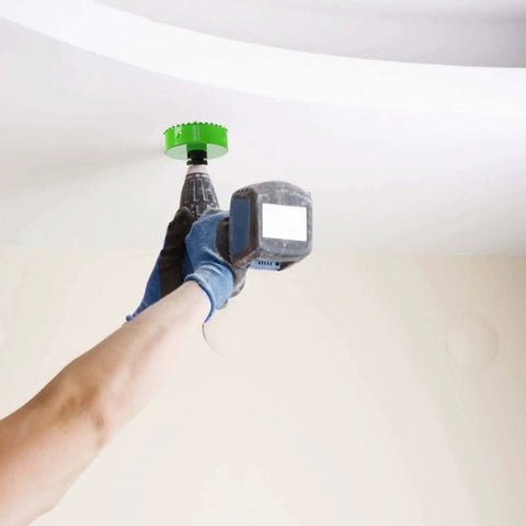 Person using Carbide Grit Hole Saw 4-1/8 Inch For 4 Inch Recessed Lights And Dryer Vents, 1-1/2 Inch Depth on ceiling.
