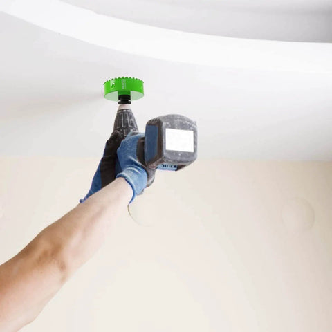 Person using carbide grit hole saw for stucco and drywall three and one half inch cutter with one and a half inch depth