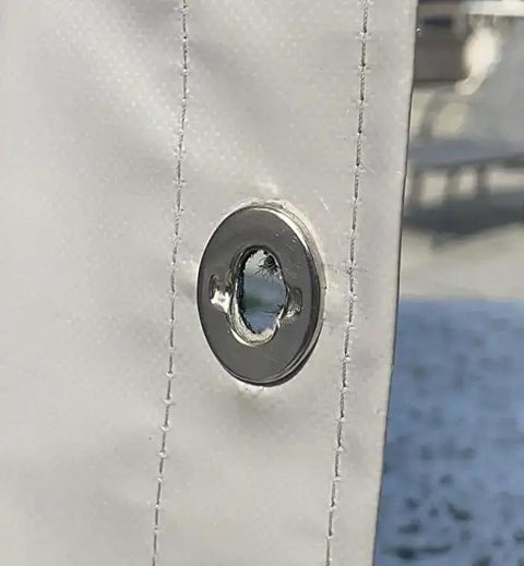 Close-up of metal eyelet on canvas for Turnbutton Fastener 6mm Kit With Cutting Tool For Boat Canopy Canvas Cover Twist Fasteners Marine