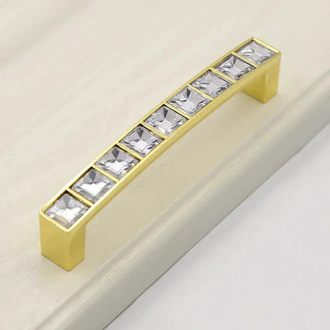 Gold U Shape Crystal Glass Cabinet Knobs Set on white surface