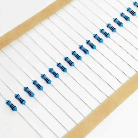 Front view of blue axial resistors with color bands arranged on a white carrier strip