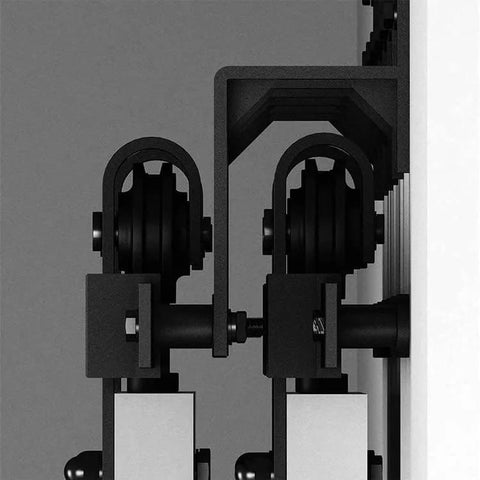 Close-up of installed Five Pack Black Barn Door Rollers with 34mm Spacers for flat track sliding barn doors, wall mount.