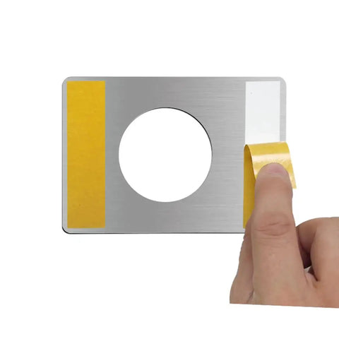 Hand holding 4 Pieces Door Reinforcement Plate Set For Door Handle Fixing Cover Filler Backplate, showcasing installation detail.