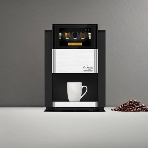 Creation 600 Single Serve Brewer for coffee, lattes, tea with in-cup frothing, shown in black with coffee cup and beans.