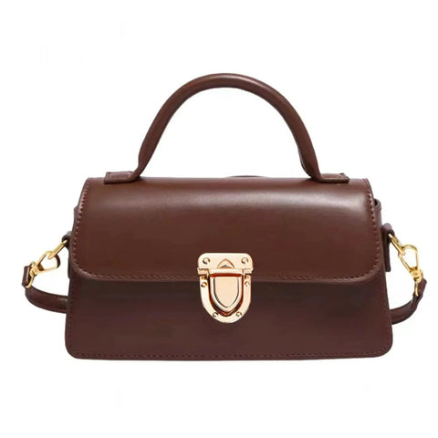 Front view of a brown handbag with a metallic twist lock clasp, showcasing sturdy metal fasteners for DIY bag projects.