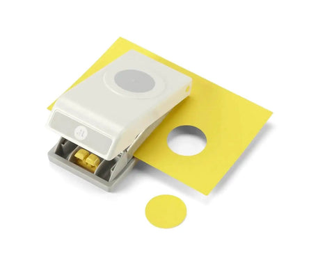 1.25 Inch Circle Punch with Safety Lock for card making, scrapbooking, gift tags, shown cutting a yellow cardstock circle