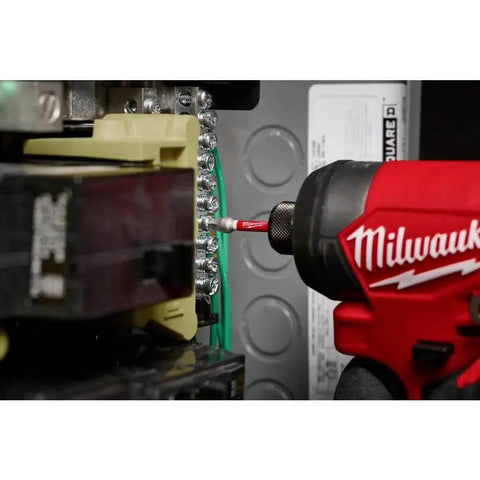 Close-up of Milwaukee Shockwave Impact Duty Driver Bit Set used in electrical panel, highlighting optimized shock zone and wear guard tip.