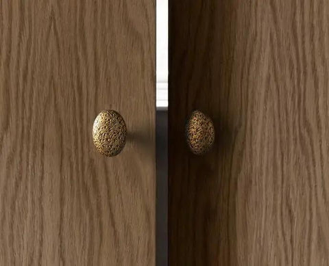 Six Pack Zinc Alloy Drawer Knobs In Big Oval Antique Brass Finish installed on wooden cabinet doors