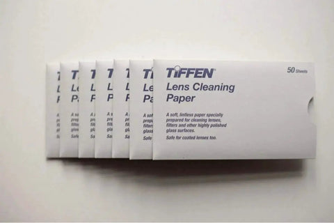Tiffen Lens Cleaning Tissue Paper Pack Of 50 Sheets For Cameras in white packaging, displayed in a row.