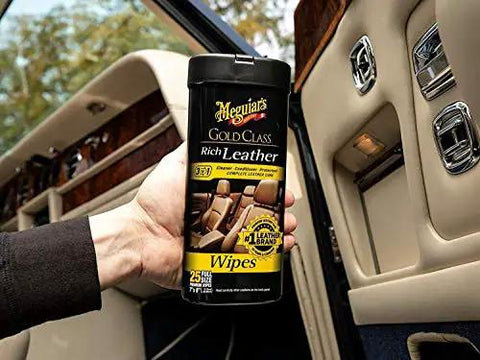 Gold Class Leather Wipes For Cars All In One Leather Cleaner Conditioner And Protector With Aloe Moisturizers 25 Large Wipes, front view, held in hand, inside car.