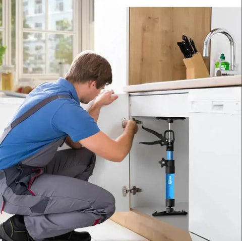 Man using 2 Pack Adjustable Steel Cabinet Jacks With Telescopic 3rd Hand Pole 132 lb Load during cabinet installation