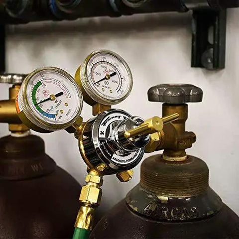Front view of Argon CO2 Regulator Kit for MIG Welder 5/32 inch, with dual scale gauge attached to gas cylinders in a workshop.
