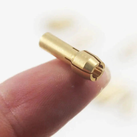 Close-up of Pro Grade Brass Collet from Pro Grade Brass Collet Set For Rotary Tools 10 Pieces Assorted Sizes 0.5mm 0.8mm 1mm 1.2mm 1.5mm High Wear Resistant Precision That Grips Bits Firmly And Keeps Stable At High Speeds Compatible With Dremel showing precise design and brass material, displayed on fingertip.