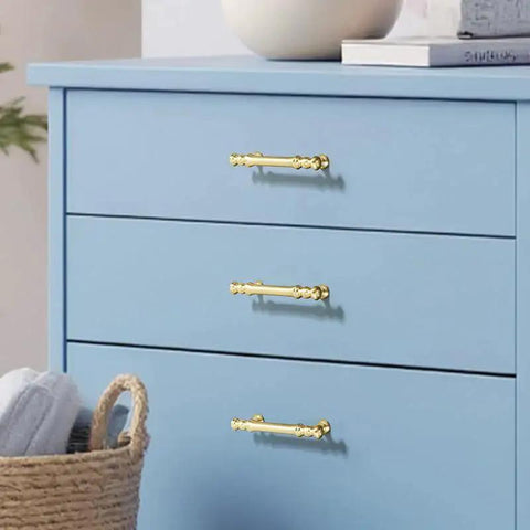 Minimalist Bright Gold Aluminum Alloy Cabinet And Wardrobe Handles Set Six Pack installed on blue drawers with 3.78 inch hole spacing