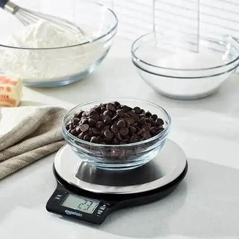 Digital Kitchen Scale With Large LCD Display And Tare Function Pro-Grade Measures In Pounds Ounces Grams Milliliters And Fluid Ounces Weighs Up To 11 Pounds Batteries Included Sleek Black And Stainless Steel with chocolate chips