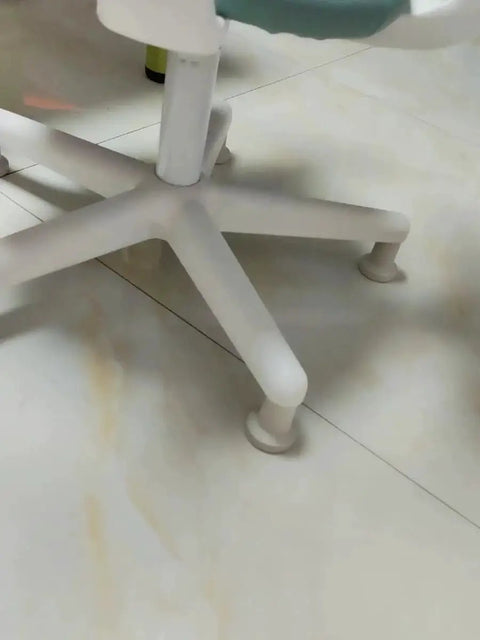 Close-up of an office chair with Bell Glides High Profile 2.5 Inch 5 Pack White for Carpet Replacement instead of wheels.