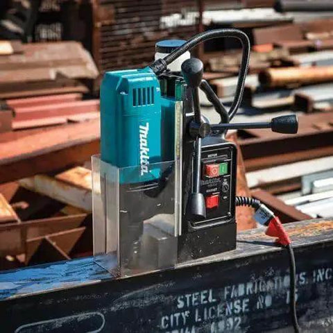 Portable Magnetic Drill For Steel With One And Three Eighths Inch Capacity And Two Inch Thick Cutting, A Real Workhorse With 850 RPM From A Ten Amp Motor, Lightweight And Compact For Tight Spaces, Removable Guard, Spindle Coolant System Makita HB350 shown on metal beam