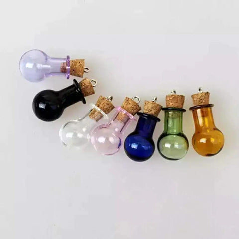Colorful glass bulb bottles with corks and eye pins for jewelry making