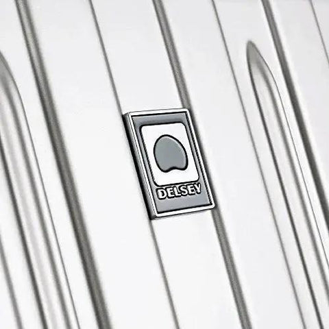 Close-up of the Delsey Paris logo on a lightweight titanium hardside expandable spinner luggage with scratch resistant matte finish.