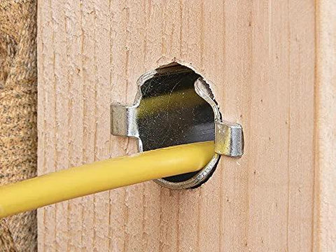 Southwire Smart Shield nail guard for electrical cables installed in a wooden stud; yellow wire passes through the hole.