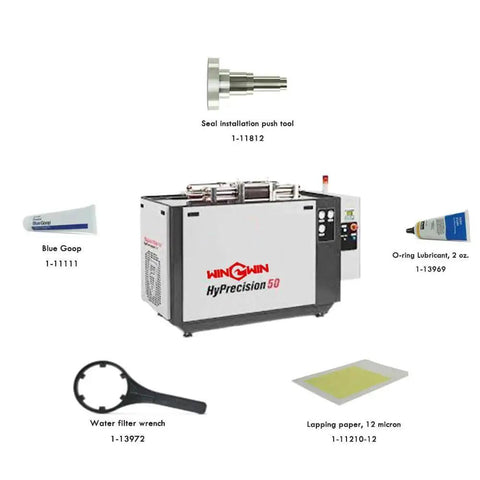 Image of various waterjet cutting machine spare parts including a HyPrecision 50 pump, seal installation push tool, and blue goop.