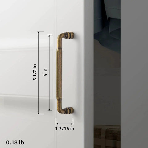 Side view of Antique Brass Cabinet Pull Handles Six Pack 5 Inch Vintage Vertical Grooved Textured Grip installed on a white cabinet.