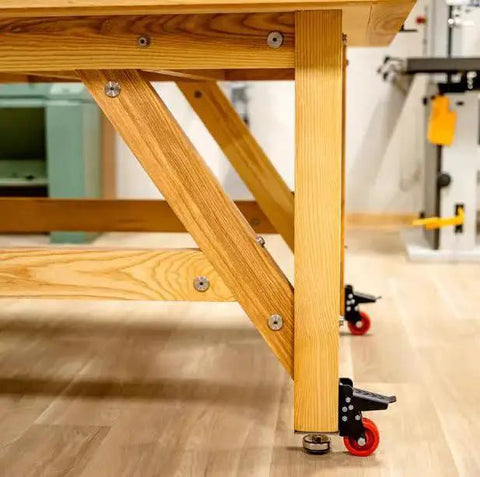 Heavy Duty Steel Caster Set For Router Tables, Workbenches, Cabinets And Tool Stands With 800 LB Capacity installed on workbench leg.