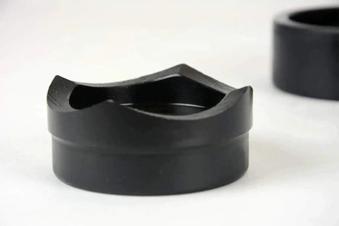 Close-up of conduit punch die from Conduit Punch And Die Set For Knockouts In 2-1/2, 3, 3-1/2 And 4 Inch Sizes, hardened tool steel.