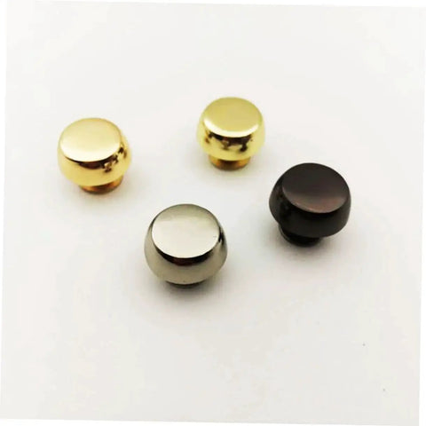 Leathercraft Bag Rivets Set For Purses Belts And Handbags DIY Decoration showing four metal rivets in different finishes.