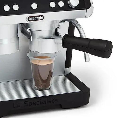 Close-up of Casdon De'Longhi toy barista coffee machine in silver/black with portafilter over a cup
