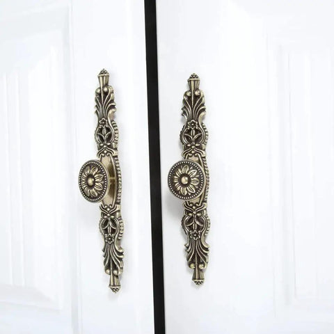 Vintage Cabinet Pulls Set of 5 in Antique Bronze With 3.7 Inch Hole Spacing on white doors