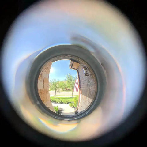 View through Solid Brass Door Peephole Viewer With 220 Degree HD Lens, showing clear outdoor scene, in Satin Nickel Finish